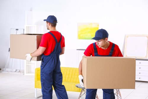 House removals planning in Greenwich with moving boxes and packing supplies