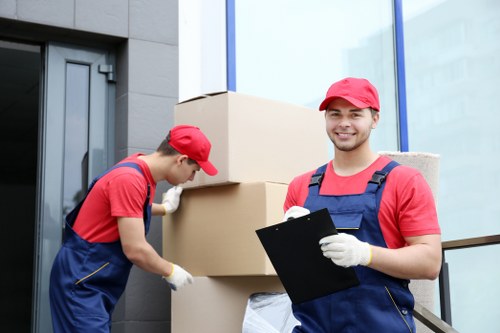 Professional movers carrying student belongings in Greenwich