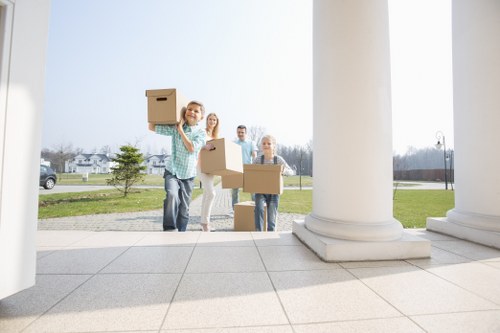 Professional movers handling furniture during a Greenwich home removal