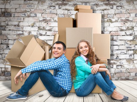 Moving boxes and furniture in a Greenwich apartment