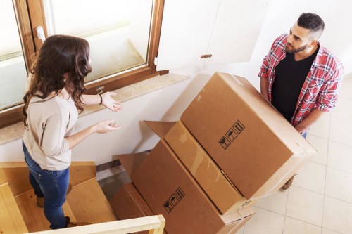 Packed moving boxes and labeled items prepared for a house removal